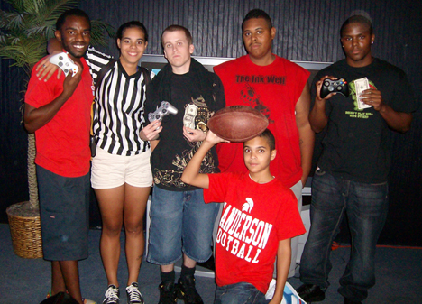 Winners VA's Finest (holding money on the left) and Alex Oden (holding money on the right).